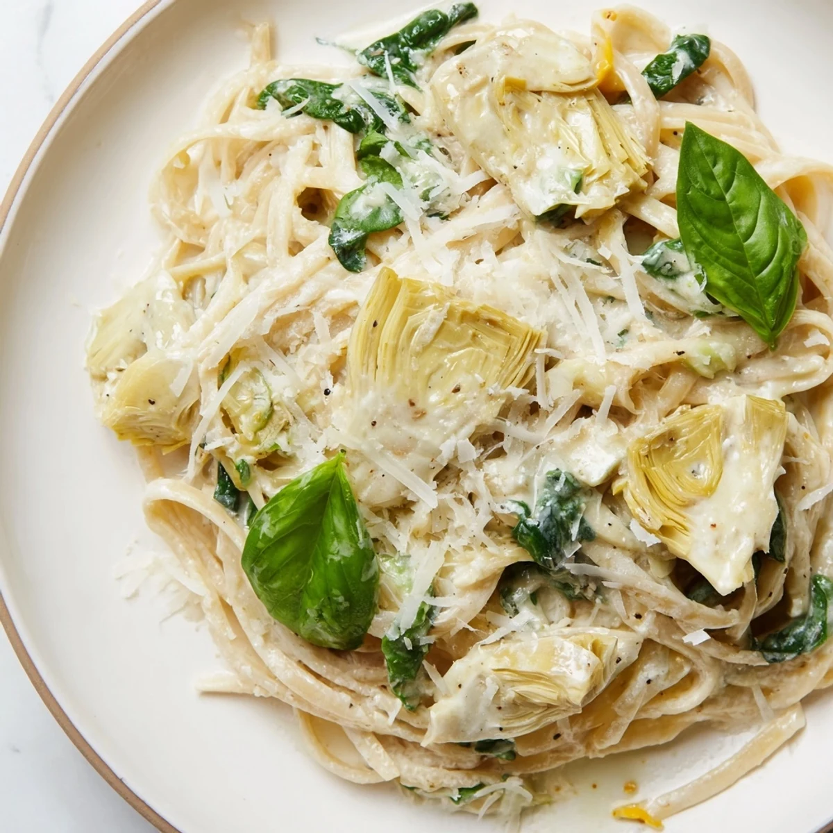 Fluffy Creamy Lemon Artichoke Pasta, a comforting Italian pasta dish with bright lemon flavor.