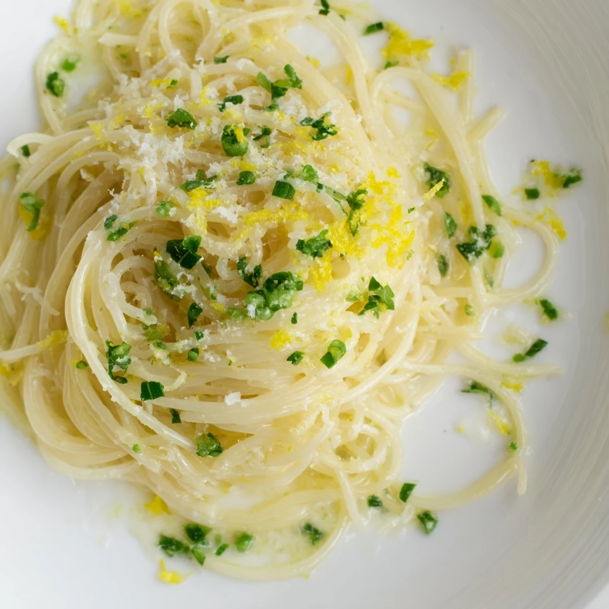 Delicate Lemon Capellini pasta tossed with herbs, perfect for a light, flavorful Italian dinner.