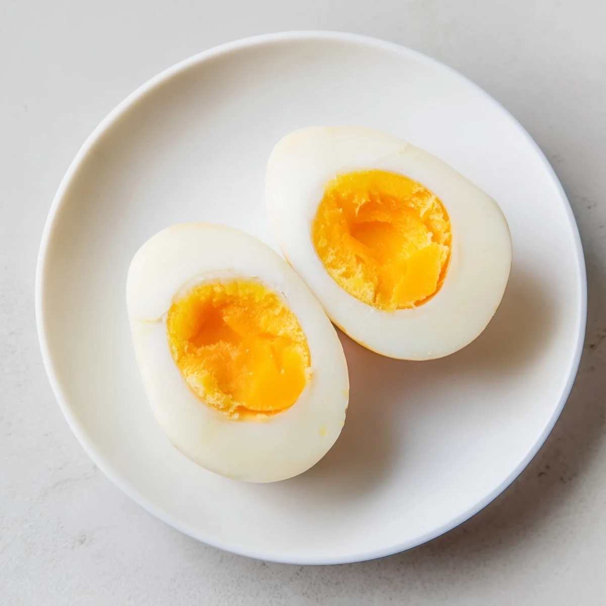 Air Fryer Boiled Eggs: A close-up of perfectly cooked eggs, ready for peeling and serving.