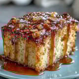 Elegant floral honey cake topped with tangy lemon glaze, a delightful European dessert for special occasions.  