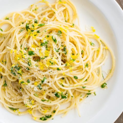 Bright, zesty Lemon Capellini, featuring angel hair pasta and a creamy lemon butter sauce.
