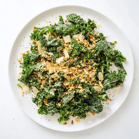 Freshly massaged kale tossed in a creamy garlic-Parmesan dressing, topped with golden toasted breadcrumbs for crunch.  