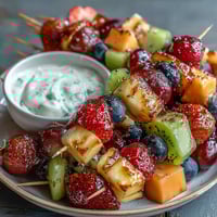 Rainbow Fruit Skewers with Honey Dip: colorful fruit kabobs arranged in rainbow order, served with a creamy honey-yogurt dip for a healthy, vibrant snack.