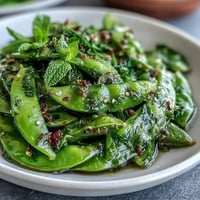 Crisp Snap Pea and Radish Spring Salad bursting with fresh mint and creamy tahini.